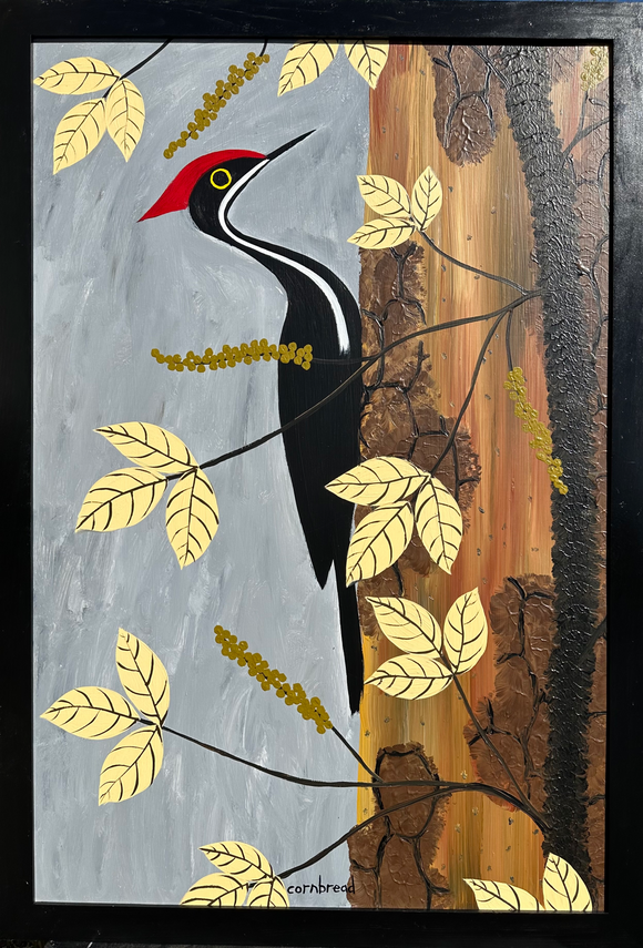 Pileated Woodpecker on a Dead Pine with a Poison Ivy Vine