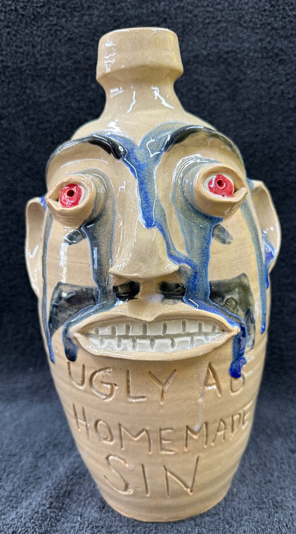 Red Eyed Glass Drips Face Jug 