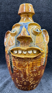 "Don't Let the Same Dog Bite You Twice" Face Jug