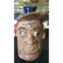 “Face Jug with Red & Blue Cap”