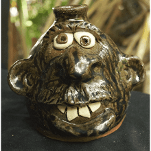 tobacco spit jug Vintage C.J. Meaders Signed Narrative Tobacco Spit Glaze, Georgia 16 H 8 W Purchased at the Smithsonian Folklife Festival A rare narrative jug by C.J. Meaders, part of the Tobacco Spit Pottery Clayton